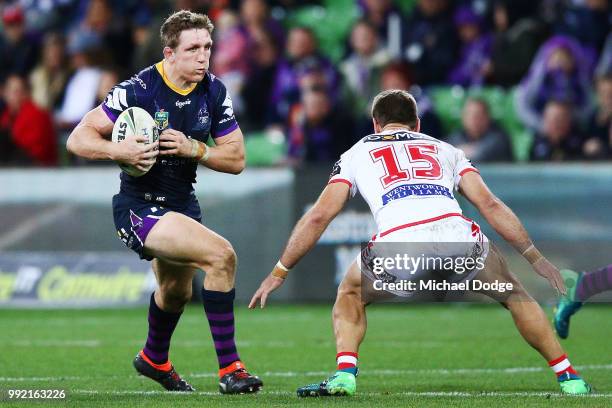 Ryan Hoffman of the Storm runs with the ball during the round 17 NRL match between the Melbourne Storm and the St George Illawarra Dragons at AAMI...