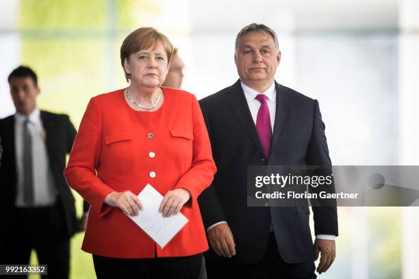 German Chancellor Angela Merkel and Viktor Orban , Prime Minister of Hungary, arrive for a press conference on July 05, 2018 in Berlin, Germany. They...