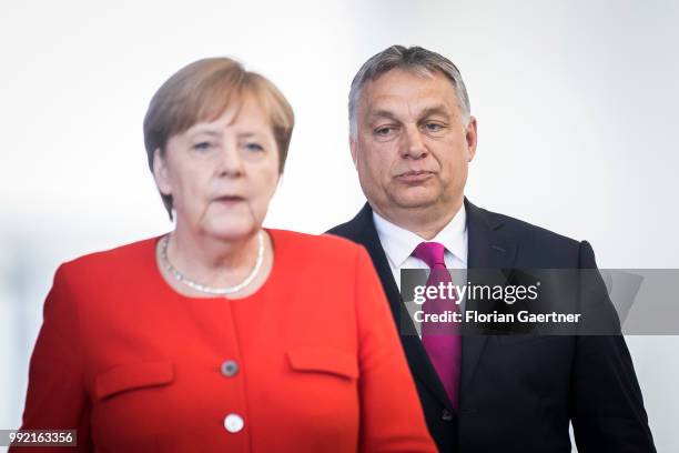 German Chancellor Angela Merkel and Viktor Orban , Prime Minister of Hungary, arrive for a press conference on July 05, 2018 in Berlin, Germany. They...