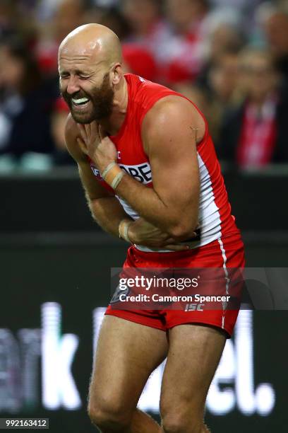 Jarrad McVeigh of the Swans injures himself during the round 16 AFL match between the Sydney Swans and the Geelong Cats at Sydney Cricket Ground on...