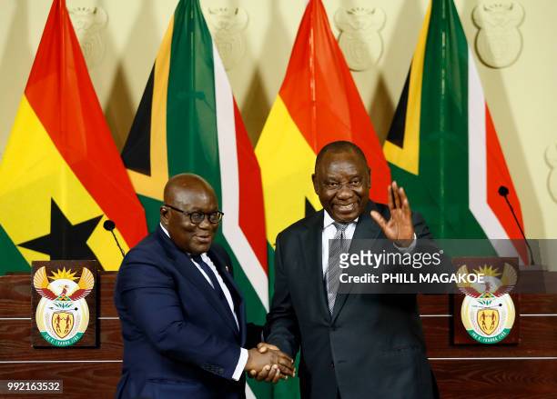 Ghana President Nana Akufo-Addo and South African President Cyril Ramaphosa shake hands after addressing a joint press conference following their...
