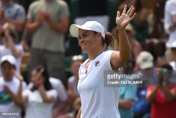 Australia's Ashleigh Barty celebrates after beating Canada's Eugenie Bouchard 6-4, 7-5 in their women's singles second round match on the fourth day...