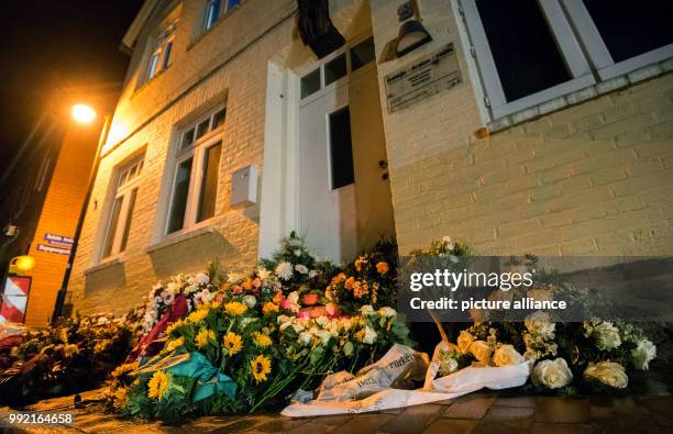 Numerous flower bouqets can be seen in front of the "Bahide Arslan House" in Moelln, Germany, 23 November 2017. A right-wing terrorist arson attack...