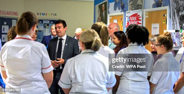 Mayor of Manchester Andy Burnham talks to staff during a visit to Trafford General Hospital to celebrate the 70th birthday of the NHS at Trafford...