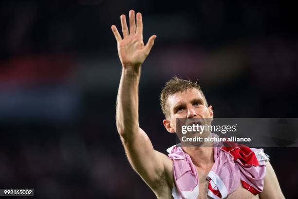 Arsenal's Per Mertesacker reacts after the UEFA Europa League Group H soccer match between 1. FC Cologne and FC Arsenal in Cologne, Germany, 23...