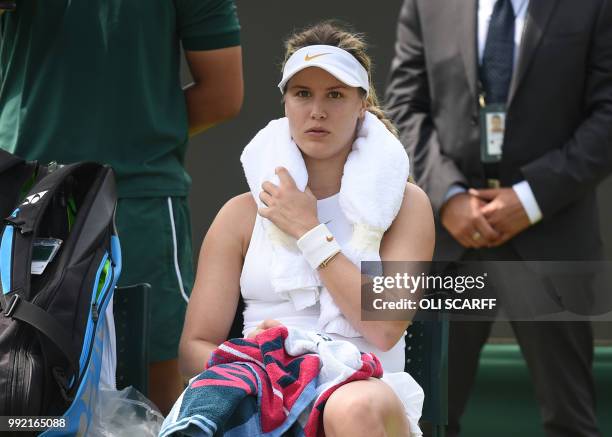 Canada's Eugenie Bouchard reacdts while playing Australia's Ashleigh Barty in their women's singles second round match on the fourth day of the 2018...