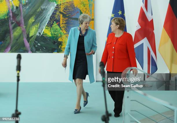 German Chancellor Angela Merkel and British Prime Minister Theresa May arrive to give statements to the media prior to talks at the Chancellery on...