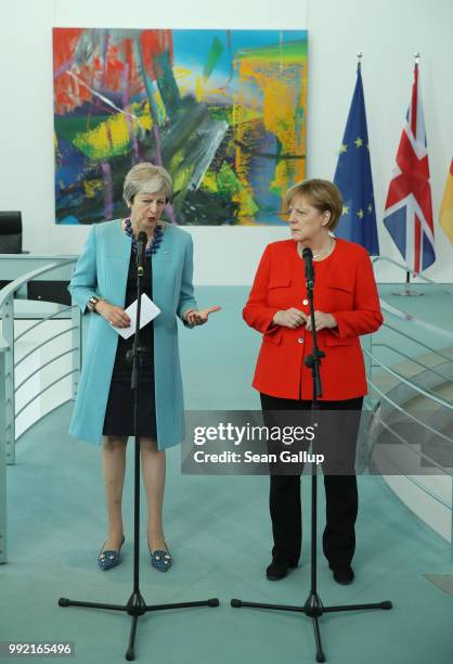 German Chancellor Angela Merkel and British Prime Minister Theresa May give statements to the media prior to talks at the Chancellery on July 5, 2018...