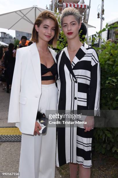 Lisa-Marie Koroll and her sister Lara-Sofie Koroll attend the Marina Hoermanseder show during the Berlin Fashion Week Spring/Summer 2019 at ewerk on...
