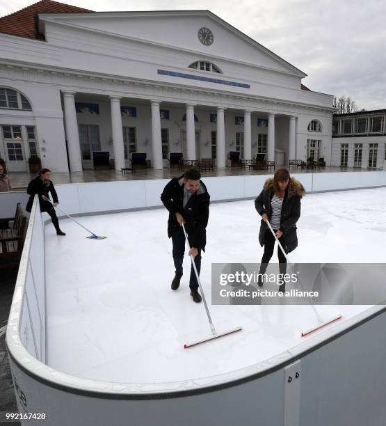 Employees test an artificial ice rink at the Grand Hotel in Heiligendamm, Germany, 24 November 2017. The 200 square meter rink made from synthetical...