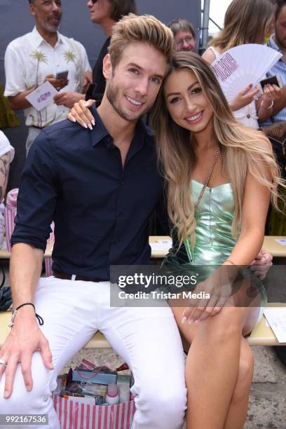 Influencer Caroline Einhoff and her boyfriend Jeff Kasser attend the Marina Hoermanseder show during the Berlin Fashion Week Spring/Summer 2019 at...