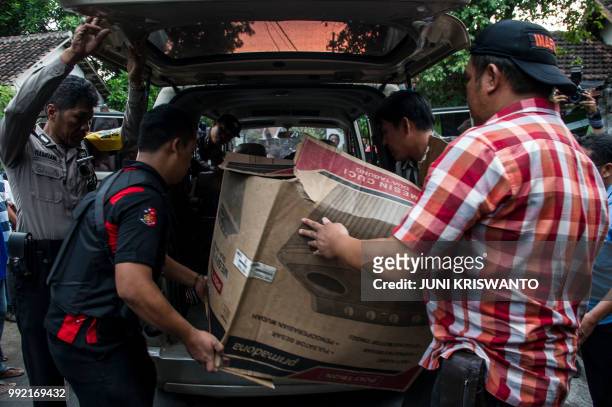 Indonesian police collect evidence from a house in the city of Bangil, East Java province on July 5 after an alleged terrorist who managed to escape...