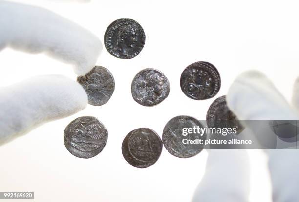 Roman silver coins are lying on a light table in the Varusschlacht Museum and Park Kalkriese in Bramsche-Kalkriese, Germany, 22 November 2017. Roman...