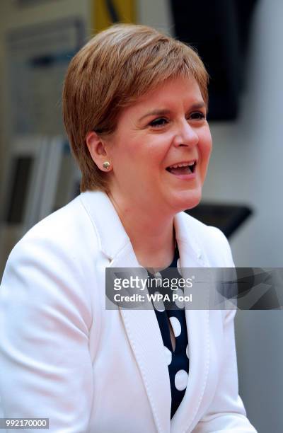 Scotland's First Minister Nicola Sturgeon smiles during a visit to the Royal Hospital for Children to mark the 70th Anniversary of the NHS on July 5...