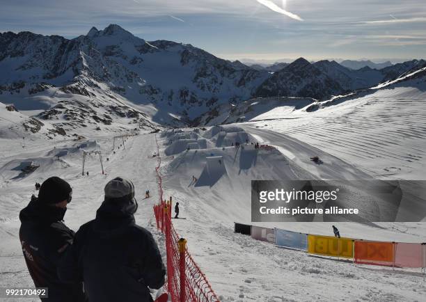 Visitors follow the course of the men's qualifications for the FIS Freeski World Cup in the Neustift im Stubaital ski area, Austria, 24 November...