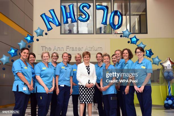 Scotland's First Minister Nicola Sturgeon speaks with members of staff during a visit to the Royal Hospital for Children to mark the 70th Anniversary...