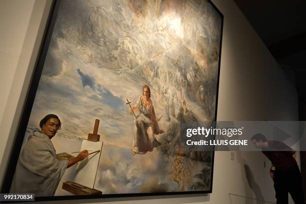 Visitor looks at the painting "The Ecumenical Council, 1960" by artist Salvador Dali during the exhibition entitled "Gala Salvador Dali, a room of...