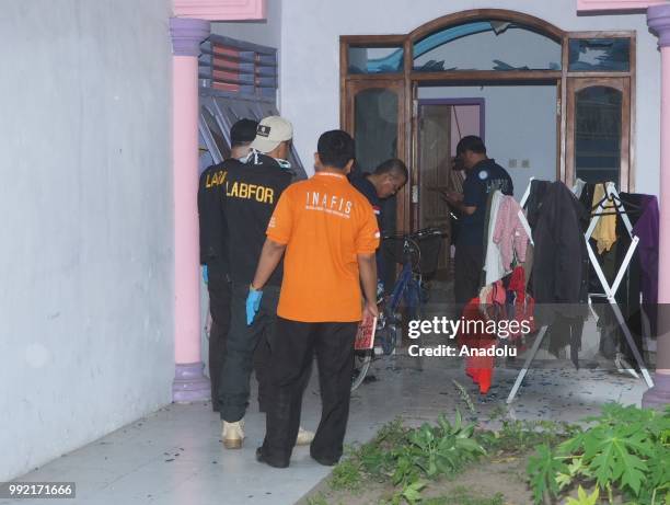 Police inspect a house where a bomb exploded in Pogar Village, Pasuruan, Indonesia, on July 5, 2018. Bombing leaves a 6-year-old boy injured.
