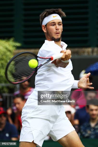 Jared Donaldson of the United States returns a shot against Stefanos Tsitsipas of Greece during their Men's Doubles first round match on day four of...