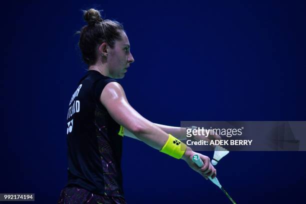 Kirsty Gilmour of Scotland prepares to serve against Sayaka Sato of Japan during their women's singles badminton match at the Indonesia Open in...