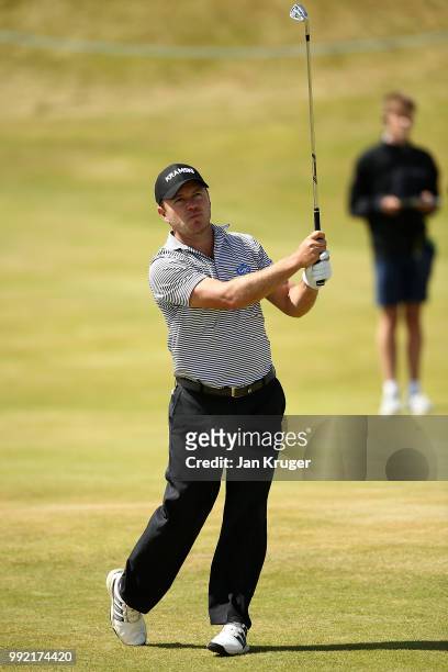 Richard Sterne of South Africa plays his second shot on the 1st hole during day one of the Dubai Duty Free Irish Open at Ballyliffin Golf Club on...