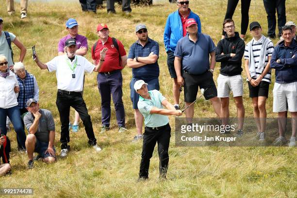 Paul Dunne of Ireland plays his second shot on the 1st hole during day one of the Dubai Duty Free Irish Open at Ballyliffin Golf Club on July 5, 2018...