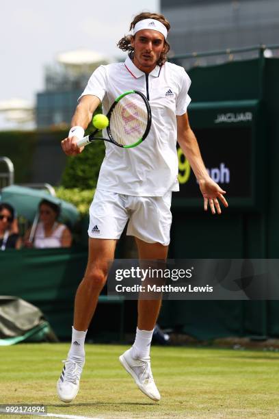 Stefanos Tsitsipas of Greece returns a shot against Jared Donaldson of the United States during their Men's Doubles first round match on day four of...