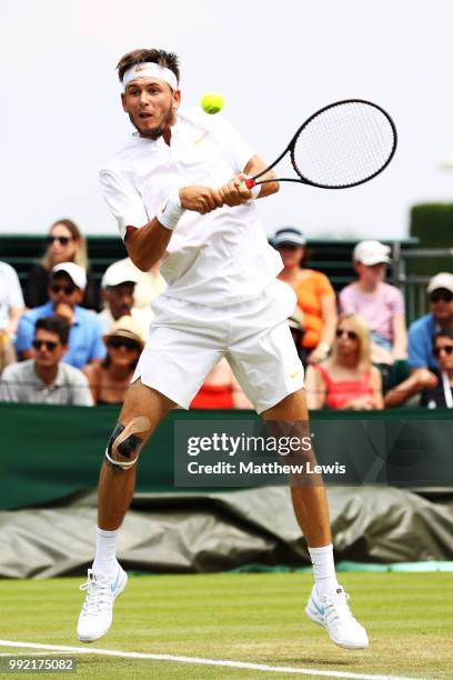 Jared Donaldson of the United States returns a shot against Stefanos Tsitsipas of Greece during their Men's Doubles first round match on day four of...