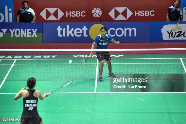 Thailand badminton player Ratchanok Intanon plays against Indonesian Gregoria Mariska Tunjung on women's singles badminton match at the Indonesia...