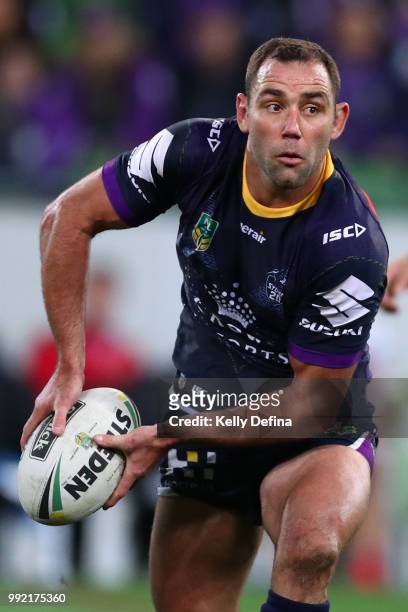 Cameron Smith of the Storm passes the ball during the round 17 NRL match between the Melbourne Storm and the St George Illawarra Dragons at AAMI Park...