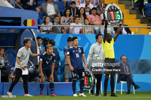 Keisuke Honda and Hotaru Yamaguchi of Japan enter the pitch during the 2018 FIFA World Cup Russia Round of 16 match between Belgium and Japan at...