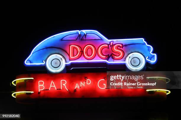 docs bar and grill neon sign - rainer grosskopf stock pictures, royalty-free photos & images