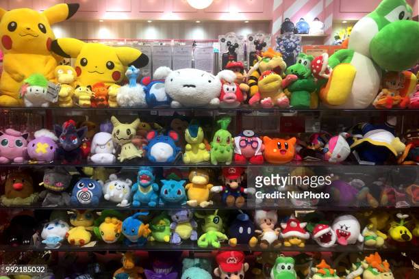 Pokemon's &quot;Pikachu&quot; and Nintendo's Super Mario stuffed toys are pictured at a shop in Tokyo, Japan, July 05, 2018.