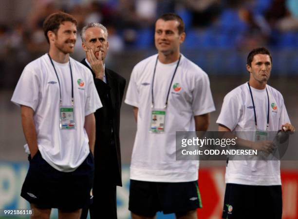 Irish coach Mick McCarthy and his players defender Kenneth Cunningham, goalkeeper Shay Given and forward Robbie Keane wait for the Group E first...