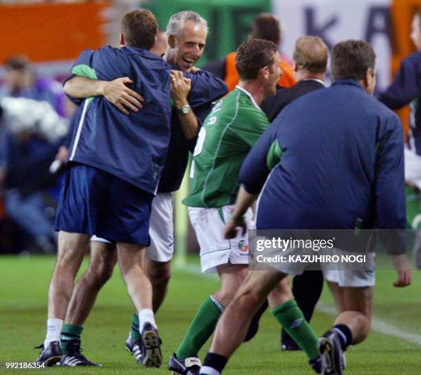 Irish coach Mick McCarthy congratulates his players at the end of the Group E first round match Germany/Ireland of the 2002 FIFA World Cup in Korea...