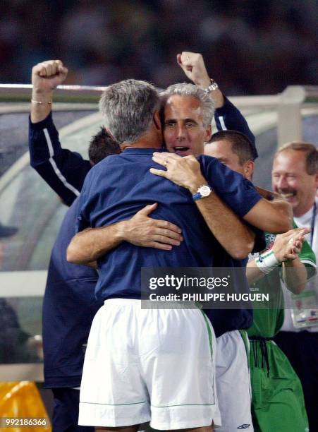 Irish coach Mick Mc Carthy hugs one of his staff member after winning the Group E first round match against Saudi Arabia counting for the 2002 FIFA...