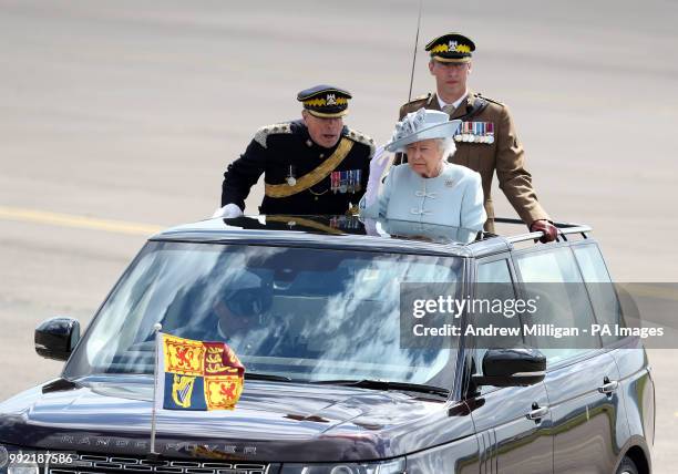 Queen Elizabeth II , Colonel-in-Chief Royal Scots Dragoon Guards with Colonel of the Regiment Brigadier H D Allfrey , arriving to present a new...