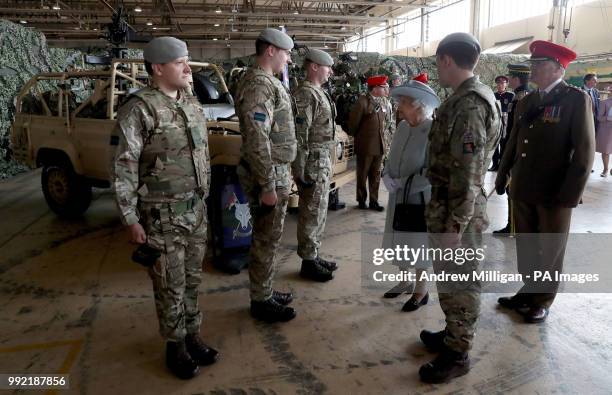 Queen Elizabeth II , Colonel-in-Chief Royal Scots Dragoon Guards meets soldiers in a hanger after she presented a new standard to the regiment at...