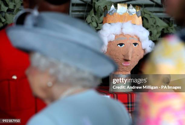 Model of the queen made by children is on display as Queen Elizabeth II , Colonel-in-Chief Royal Scots Dragoon Guards attends a reception after she...