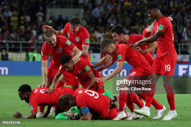 Jordan Pickford of England is mobbed by teammates in celebration after penalty shootout following the 2018 FIFA World Cup Russia Round of 16 match...