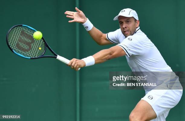 Luxembourg's Gilles Muller returns against Germany's Philipp Kohlschreiber during their men's singles second round match on the fourth day of the...