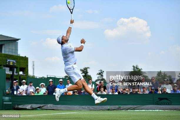 Luxembourg's Gilles Muller returns against Germany's Philipp Kohlschreiber during their men's singles second round match on the fourth day of the...