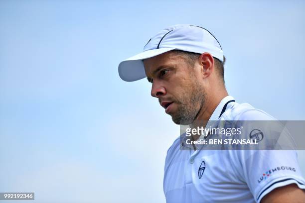 Luxembourg's Gilles Muller reacts against Germany's Philipp Kohlschreiber during their men's singles second round match on the fourth day of the 2018...
