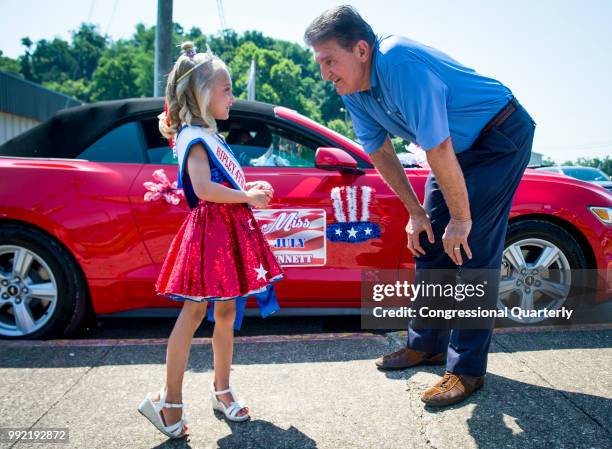 July 4: Sen. Joe Manchin, R-W.Va., chats with Little Miss 4th of July before the start of the Ripley 4th of July Grand Parade in Ripley, West...