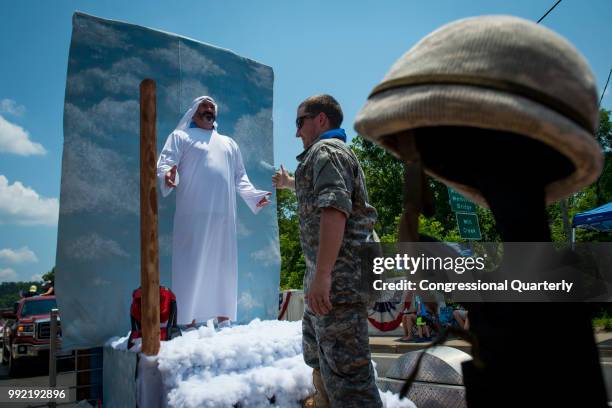 July 4: A man dressed as Jesus and a man dressed as a U.S. Army solider pose on a float during the Ripley 4th of July Grand Parade in Ripley, West...