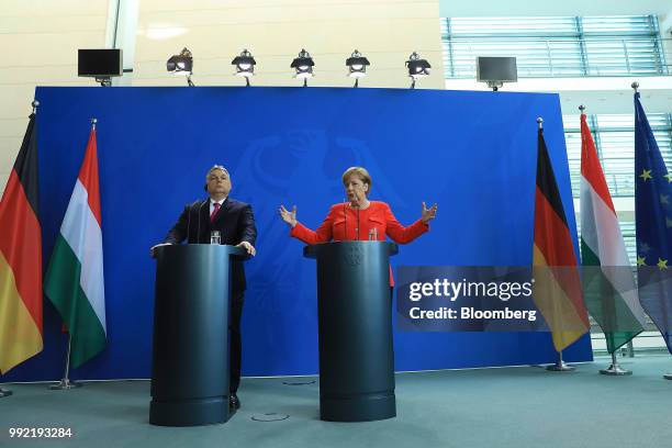 Angela Merkel, Germany's chancellor, right, gestures while speaking beside Viktor Orban, Hungary's prime minister, during a news conference at the...