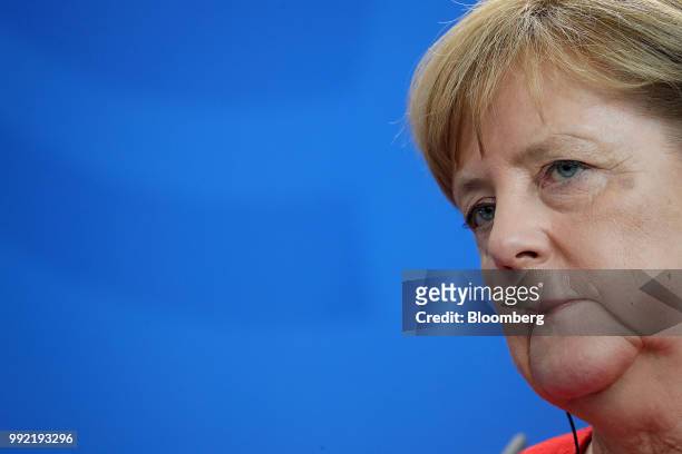 Angela Merkel, Germany's chancellor, listens during a news conference at the Chancellery in Berlin, Germany, on Thursday July 2018. A former senior...