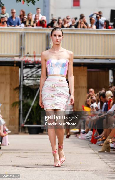 Model, bag detail, walks the runway at the Marina Hoermanseder show during the Berlin Fashion Week Spring/Summer 2019 at ewerk on July 5, 2018 in...