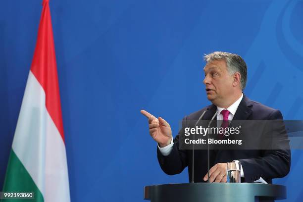Viktor Orban, Hungary's prime minister, gestures while speaking during a news conference at the Chancellery in Berlin, Germany, on Thursday July...