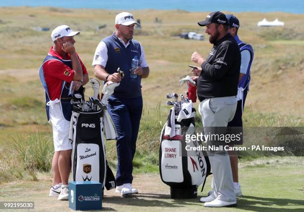 England's Lee Westwood speaks with Ireland's Shane Lowry in the seventh tee box during day one of the Dubai Duty Free Irish Open at Ballyliffin Golf...